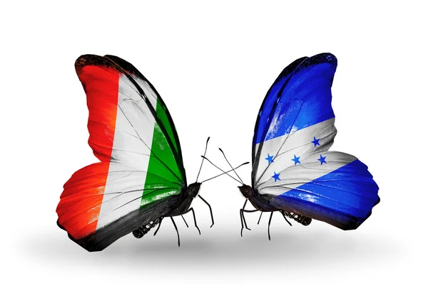 Butterflies with Cote Divoire and Honduras flags — Stock Photo, Image