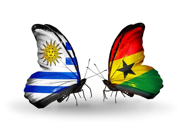 Butterflies with Uruguay and Ghana flags — Stock Photo, Image