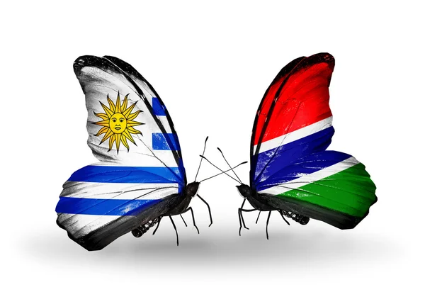 Butterflies with   Uruguay and Gambia flags — Stock Photo, Image