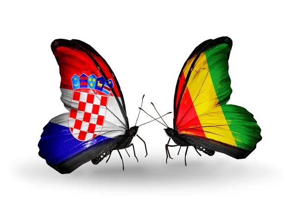 Butterflies with Croatia and Guinea flags — Stock Photo, Image