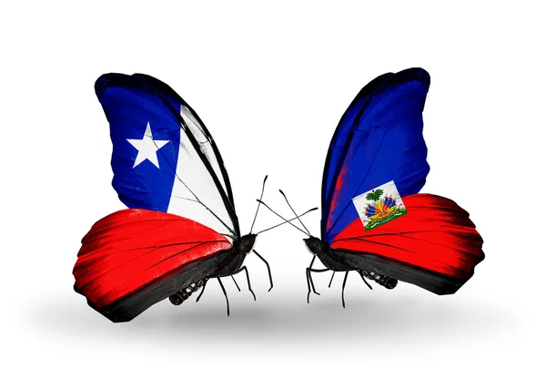 Butterflies with Chile and Haiti flags — Stock Photo, Image