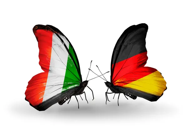 Butterflies with Cote Divoire and Germany flags — Stock Photo, Image