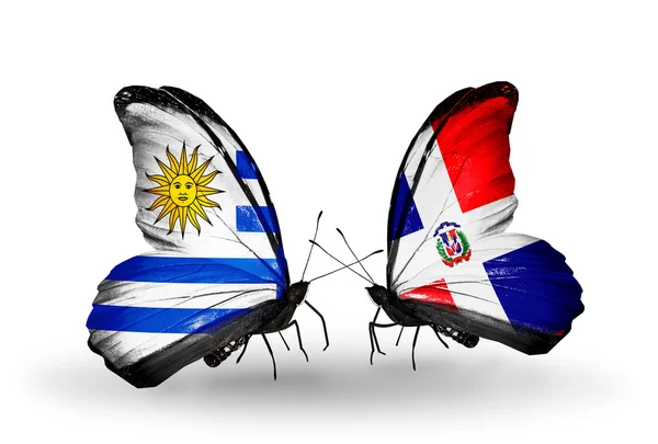 Butterflies with  Uruguay and Dominicana flags — Stock Photo, Image