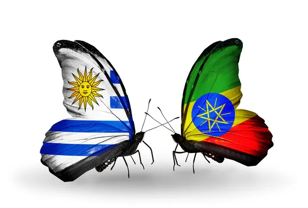 Butterflies with Uruguay and Ethiopia flags — Stock Photo, Image