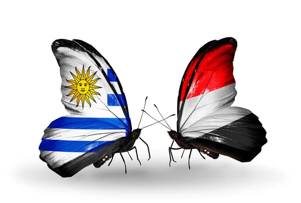 Borboletas com bandeiras do Uruguai e do Iêmen — Fotografia de Stock