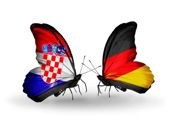 Бабочки с флагами Хорватии и Германии — стоковое фото