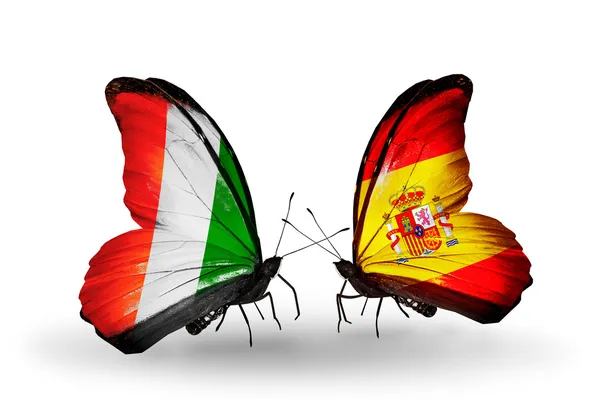 Butterflies with Cote Divoire and Spain flags — Stock Photo, Image