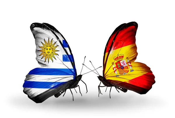Πεταλούδες με σημαίες της Ουρουγουάης και Ισπανία — Φωτογραφία Αρχείου
