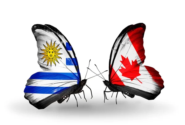 Papillons avec drapeaux Uruguay et Canada — Photo