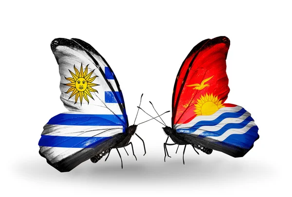 Butterflies with Uruguay and Kiribati flags — Stock Photo, Image