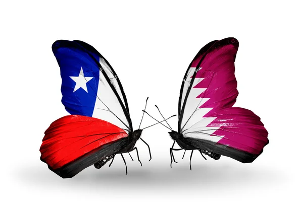 Butterflies with  Chile and Qatar flags — Stock Photo, Image