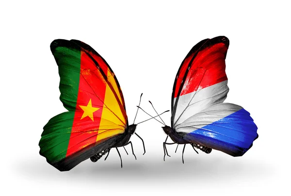 Butterflies with Cameroon and Luxembourg flags — Stock Photo, Image