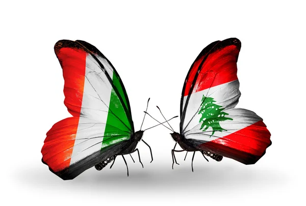 Butterflies with Cote Divoire and Lebanon flags — Stock Photo, Image