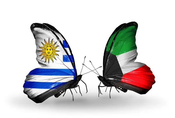 Butterflies with Uruguay and Kuwait flags — Stock Photo, Image