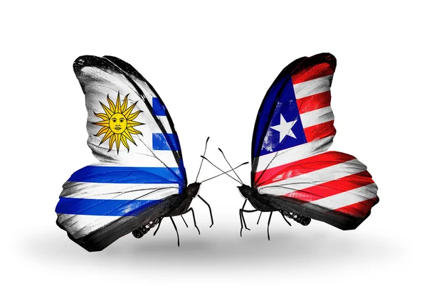 Farfalle con bandiere Uruguay e Liberia — Foto Stock