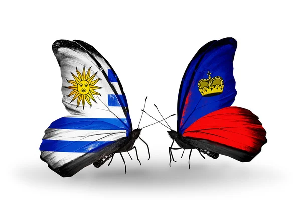Butterflies with Uruguay and Liechtenstein flags — Stock Photo, Image