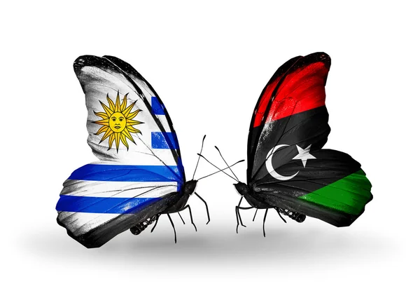 Vlinders met uruguay en Libië vlaggen — Stockfoto