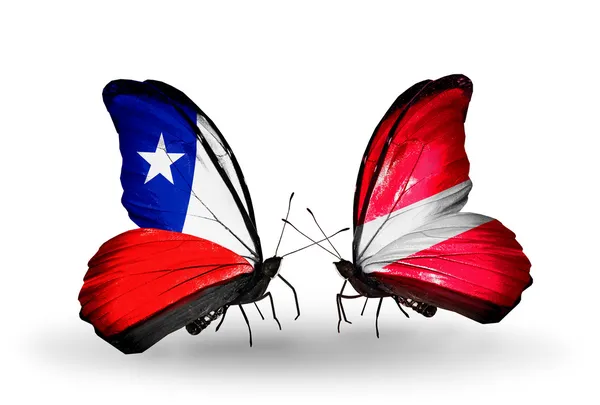 Butterflies with Chile and Latvia flags — Stock Photo, Image