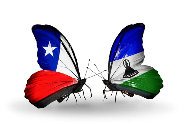 Butterflies with Chile and Lesotho flags — Stock Photo, Image