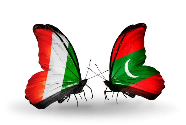 Butterflies with Cote Divoire and Maldives flags — Stock Photo, Image