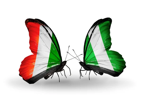 Butterflies with Cote Divoire and Nigeria flags — Stock Photo, Image