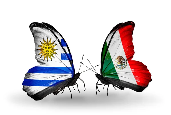 Butterflies with Uruguay and Mexico flags — Stock Photo, Image