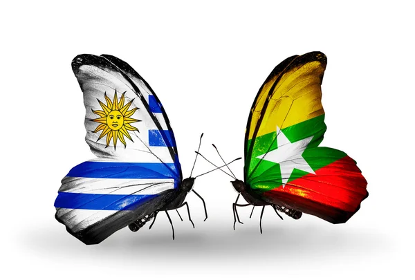 Butterflies with  Uruguay and Myanmar flags — Stock Photo, Image
