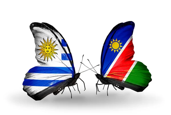 Farfalle con bandiere Uruguay e Namibia — Foto Stock