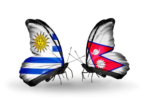 Butterflies with  Uruguay and Nepal flags — Stock Photo, Image