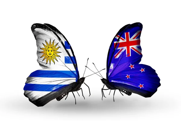 Motyle z Nowej Zelandii i Urugwaju flagi — Zdjęcie stockowe