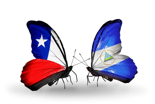 Borboletas com bandeiras do Chile e Nicarágua — Fotografia de Stock