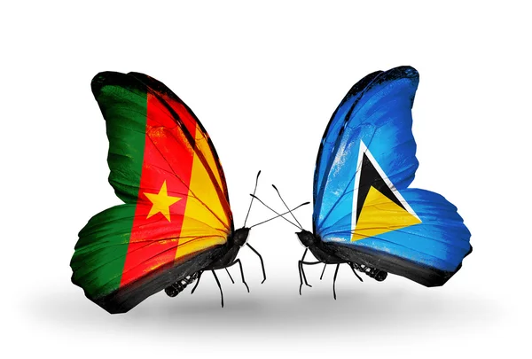 Butterflies with  Cameroon and Saint Lucia flags — Stock Photo, Image