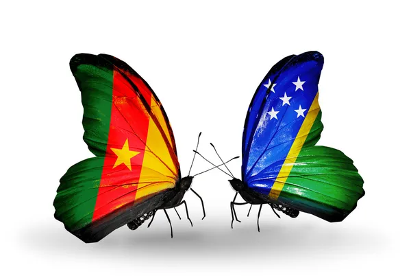 Butterflies with Cameroon and Solomon Islands flags — Stock Photo, Image