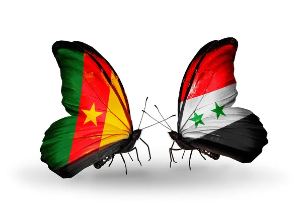 Schmetterlinge mit Kamerun- und Syrienfahnen — Stockfoto