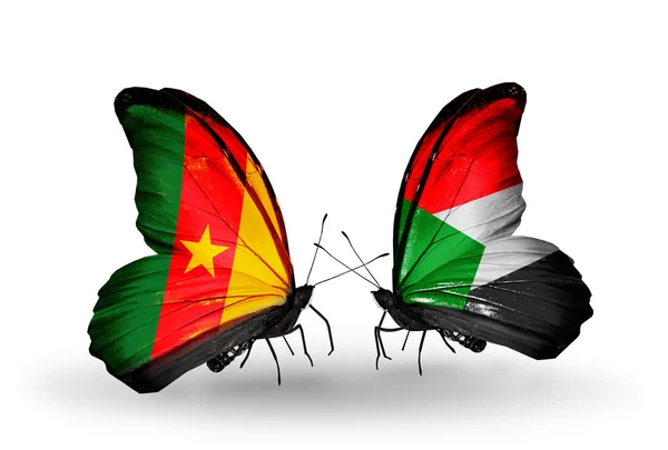 Butterflies with Cameroon and Sudan flags — Stock Photo, Image