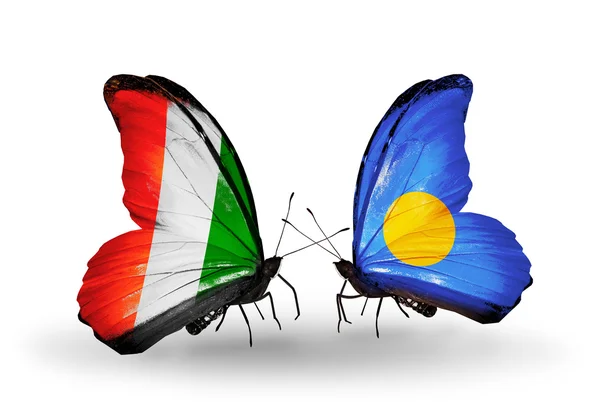 Butterflies with Cote Divoire and Palau flags — Stock Photo, Image