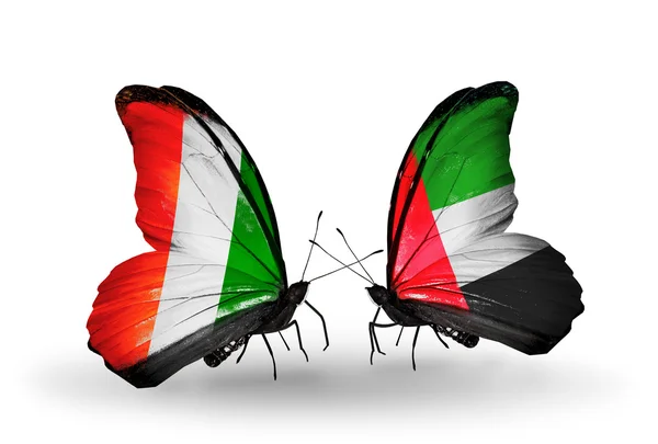 Mariposas con banderas Cote Divoire y Emiratos Árabes Unidos — Foto de Stock
