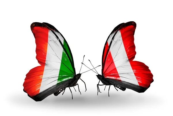 Butterflies with Cote Divoire and Peru flags — Stock Photo, Image