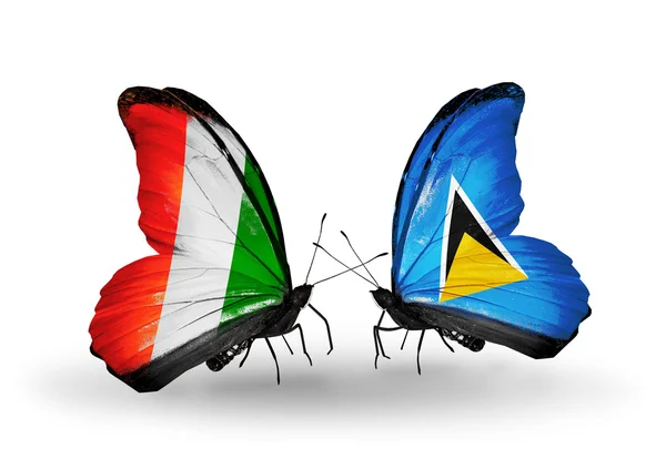 Butterflies with Cote Divoire and Saint Lucia flags — Stock Photo, Image