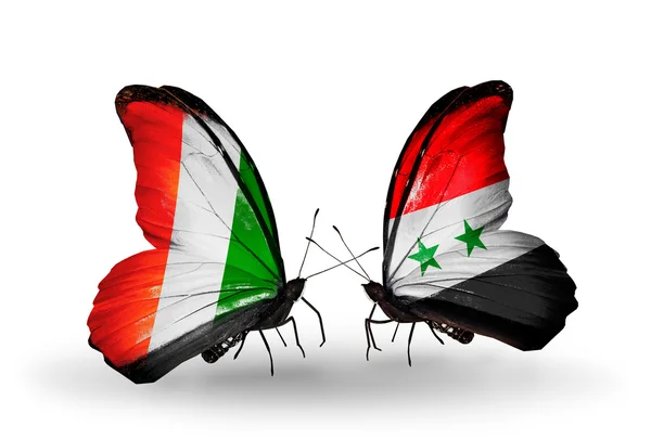 Butterflies with Cote Divoire and Syria flags — Stock Photo, Image