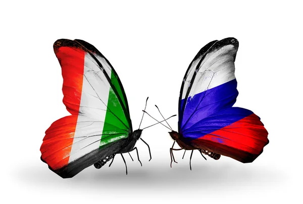 Borboletas com bandeira da Costa do Marfim e da Rússia — Fotografia de Stock