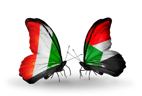 Butterflies with Cote Divoire and Sudan flags — Stock Photo, Image