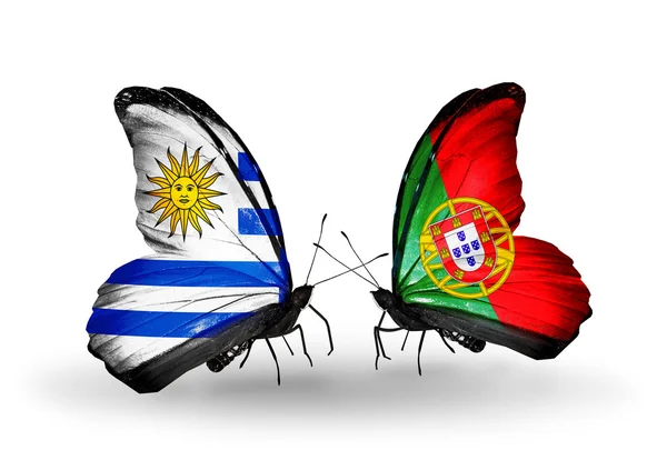 Butterflies with Uruguay and Portugal flags — Stock Photo, Image