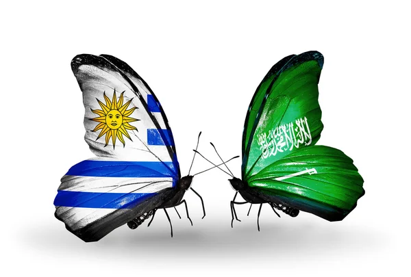 Butterflies with Uruguay and Saudi Arabia flags — Stock Photo, Image