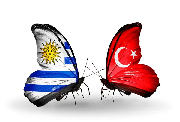 Borboletas com bandeiras do Uruguai e da Turquia — Fotografia de Stock