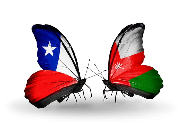 Butterflies with Chile and Oman flags — Stock Photo, Image