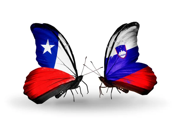 Butterflies with Chile and Slovenia flags — Stock Photo, Image