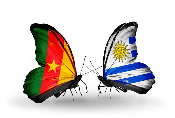 Butterflies with Cameroon and Uruguay flags — Stock Photo, Image