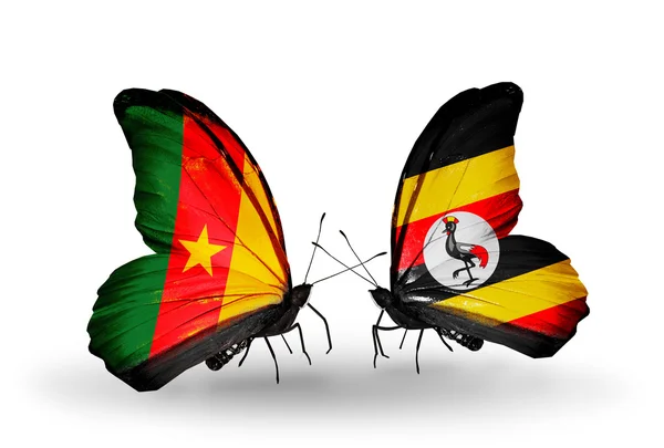 Butterflies with Cameroon and Uganda flags — Stock Photo, Image