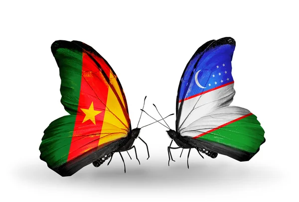 Butterflies with Cameroon and Uzbekistan flags — Stock Photo, Image